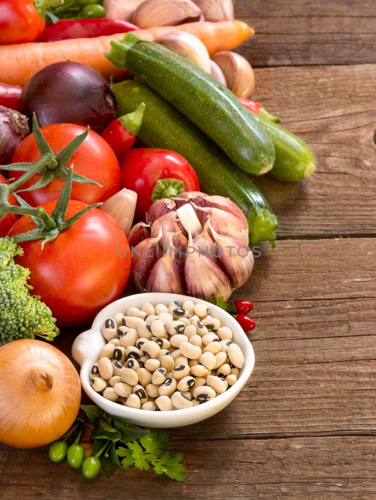 Black eyed peas in a bowl and vegetables