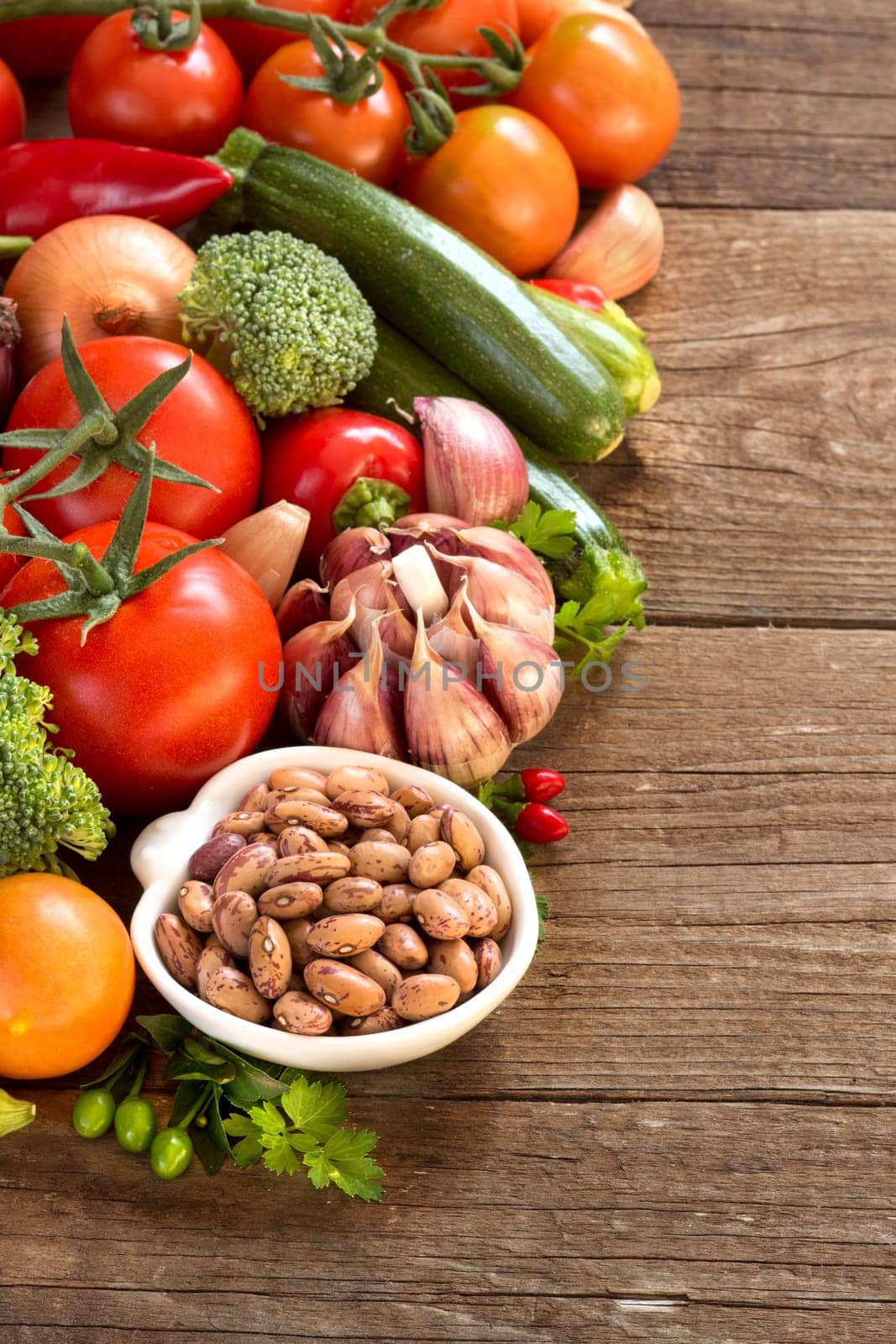 Pinto beans in a bowl and vegetables