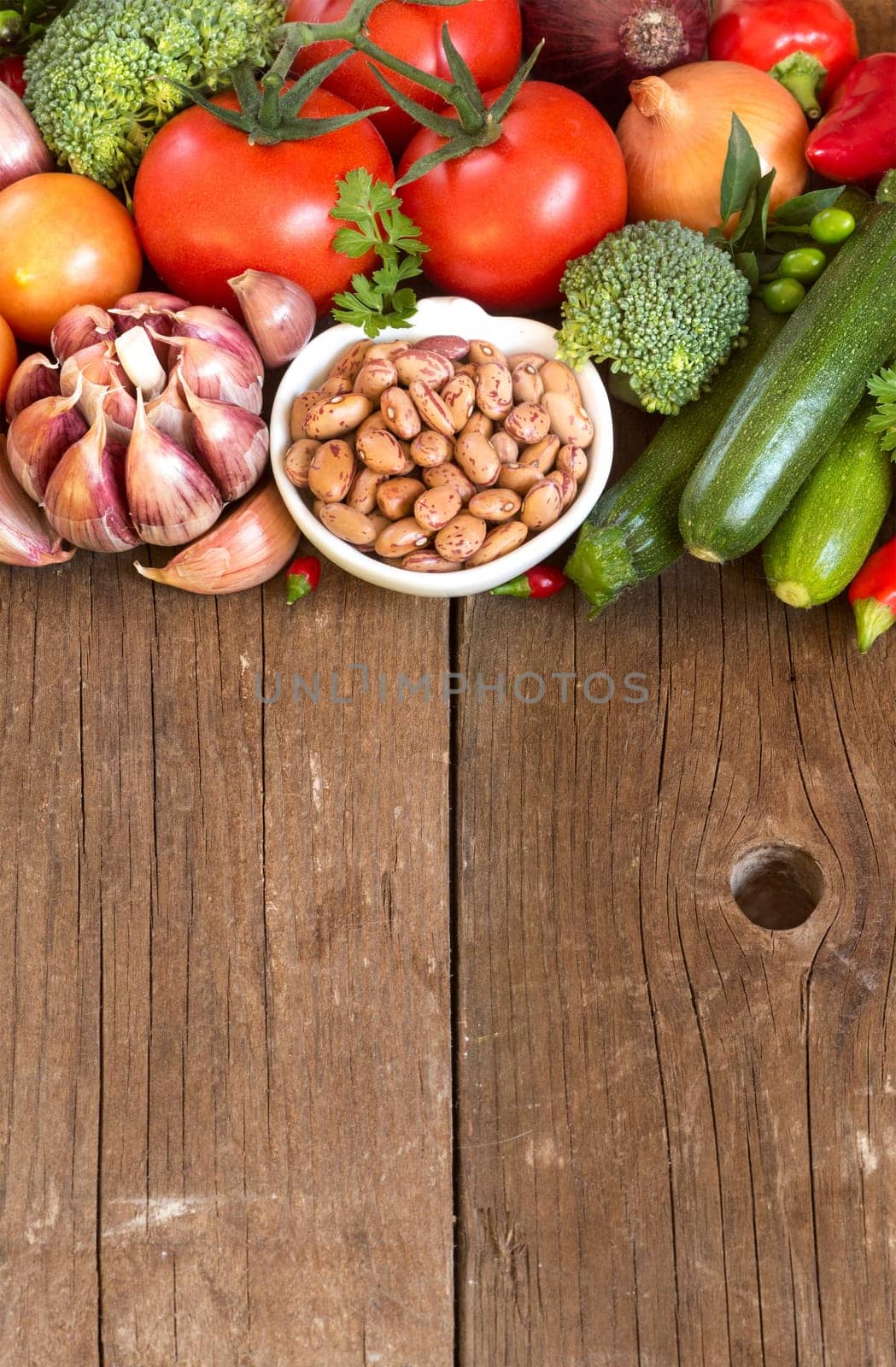 Pinto beans in a bowl and vegetables