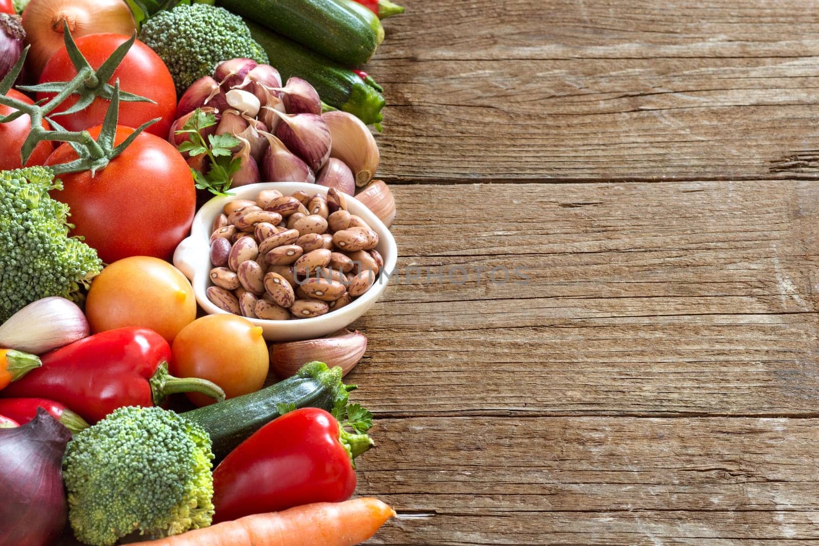 Pinto beans in a bowl and vegetables