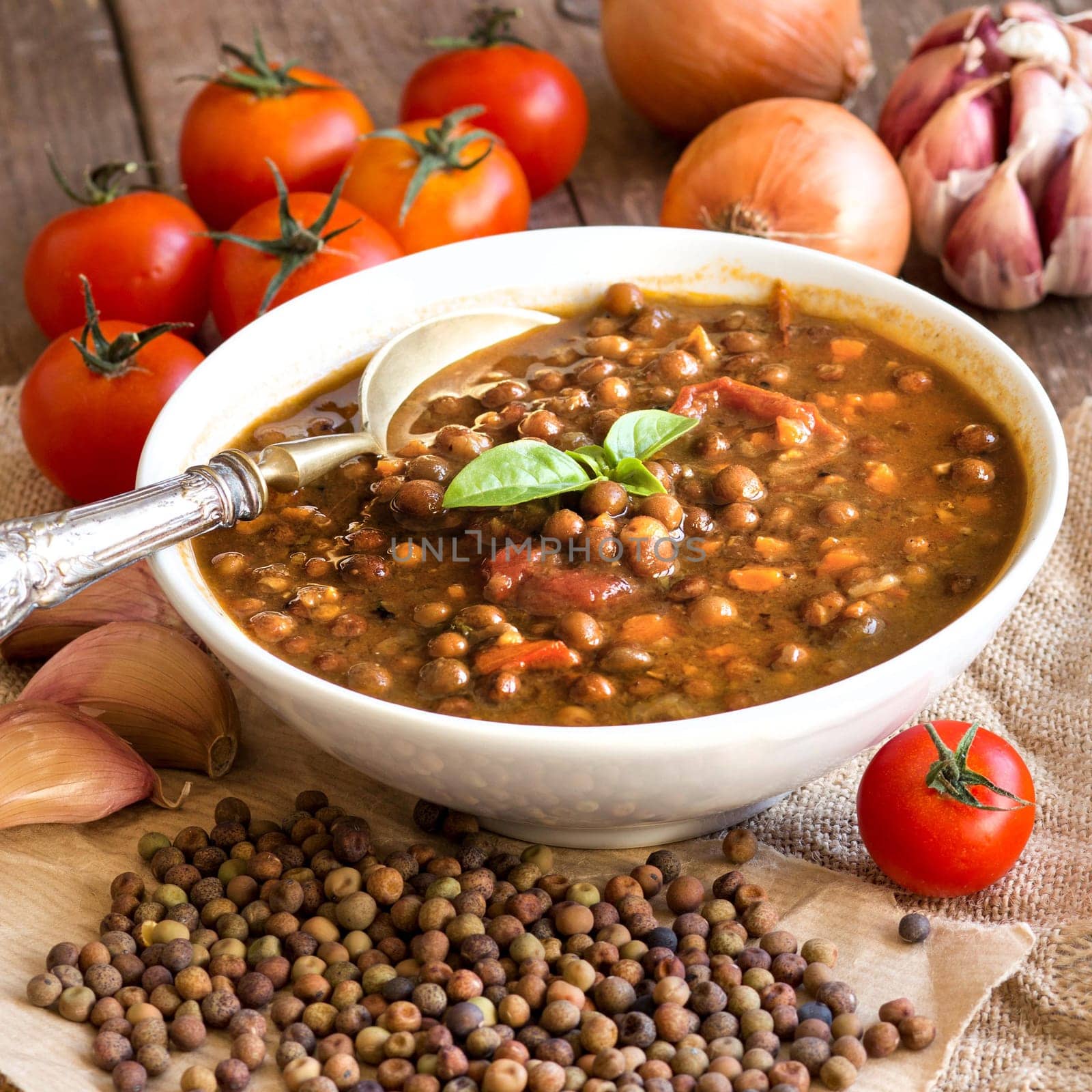 Cooked roveja stew with cherry tomatoes, garlic and onion