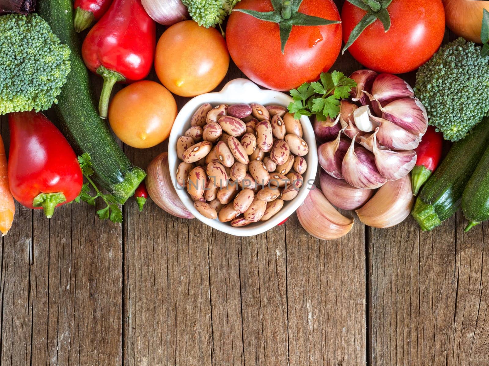 Pinto beans in a bowl and vegetables