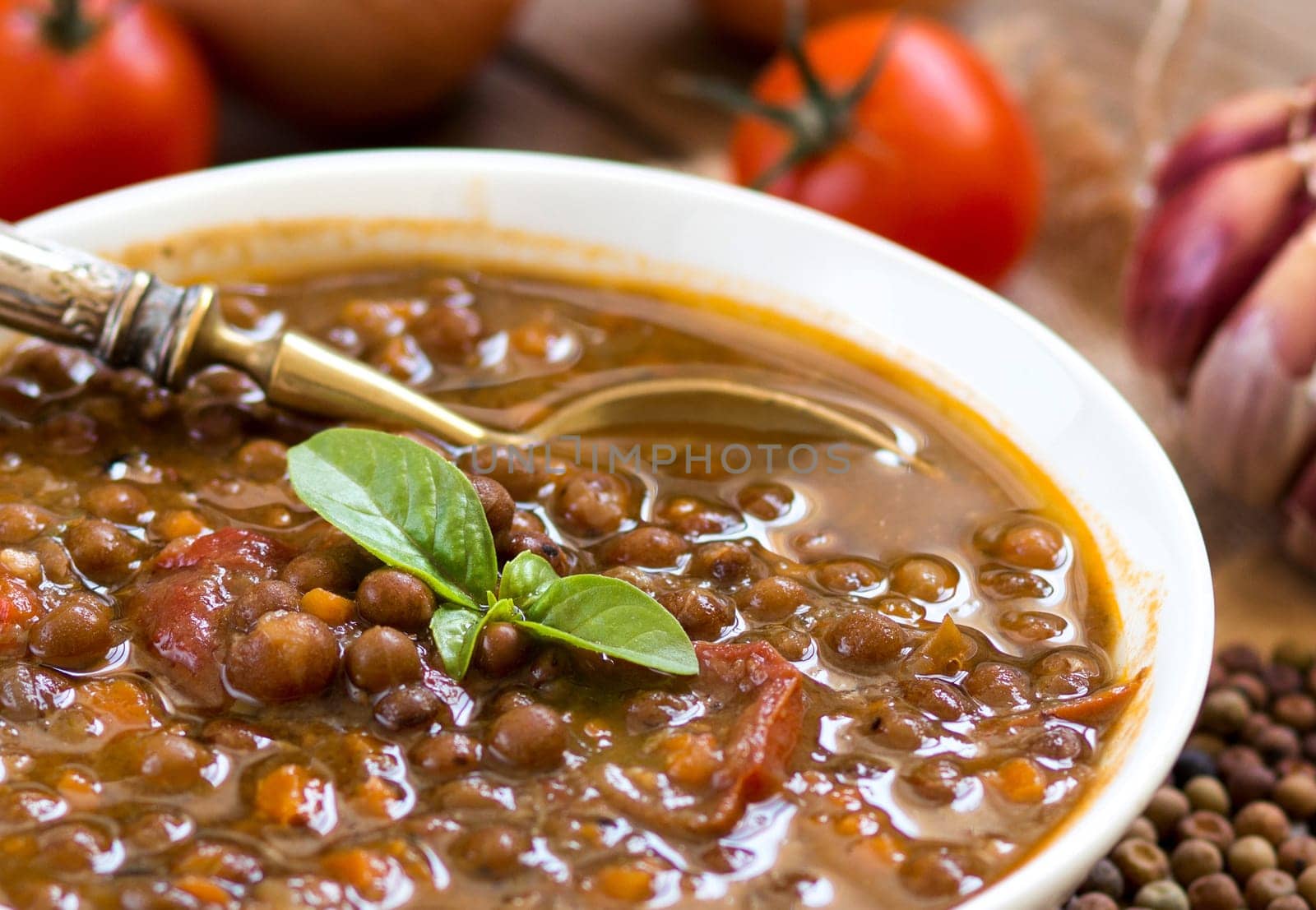 Cooked roveja stew with cherry tomatoes, garlic and onion