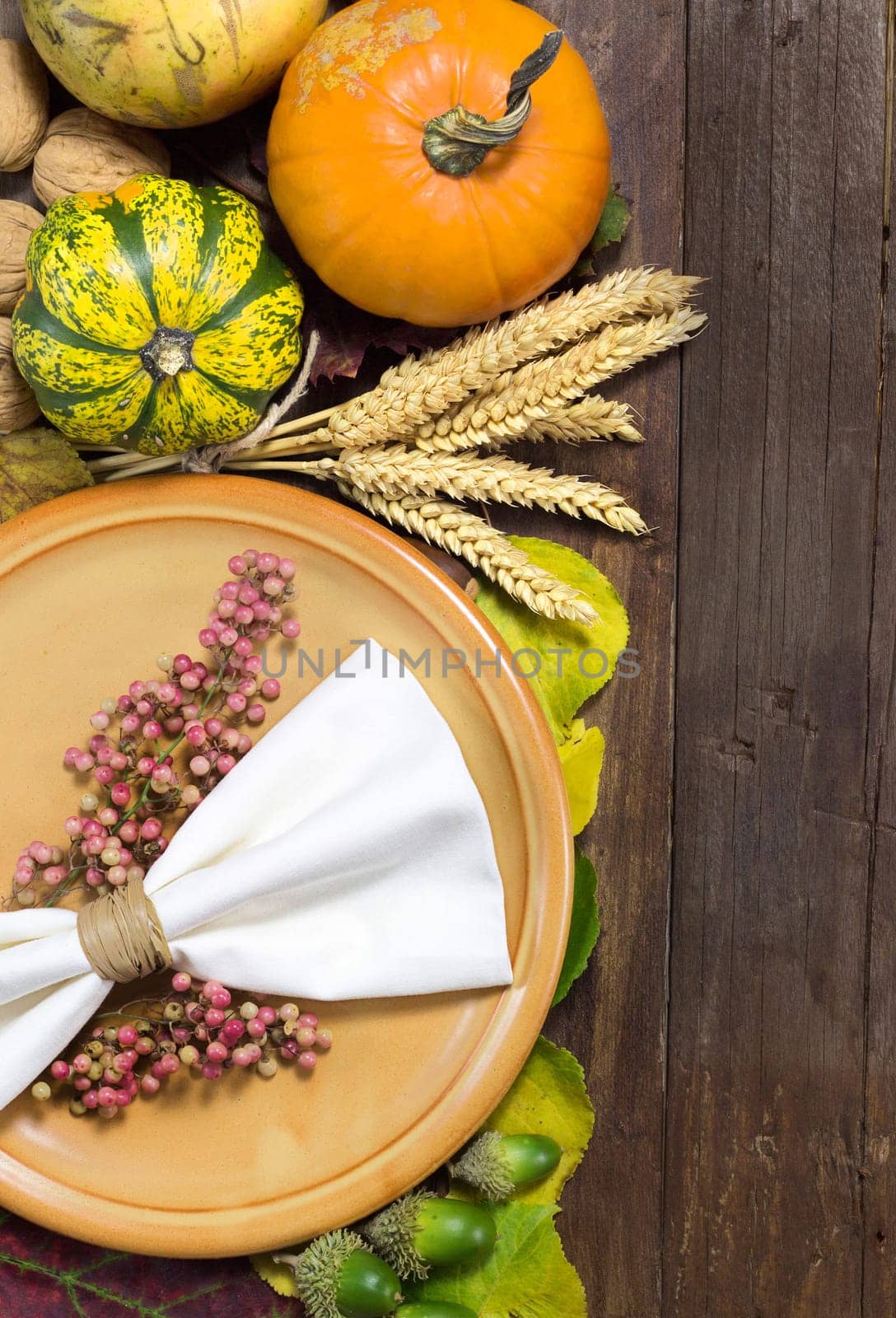 Rustic autumn table setting on wooden table