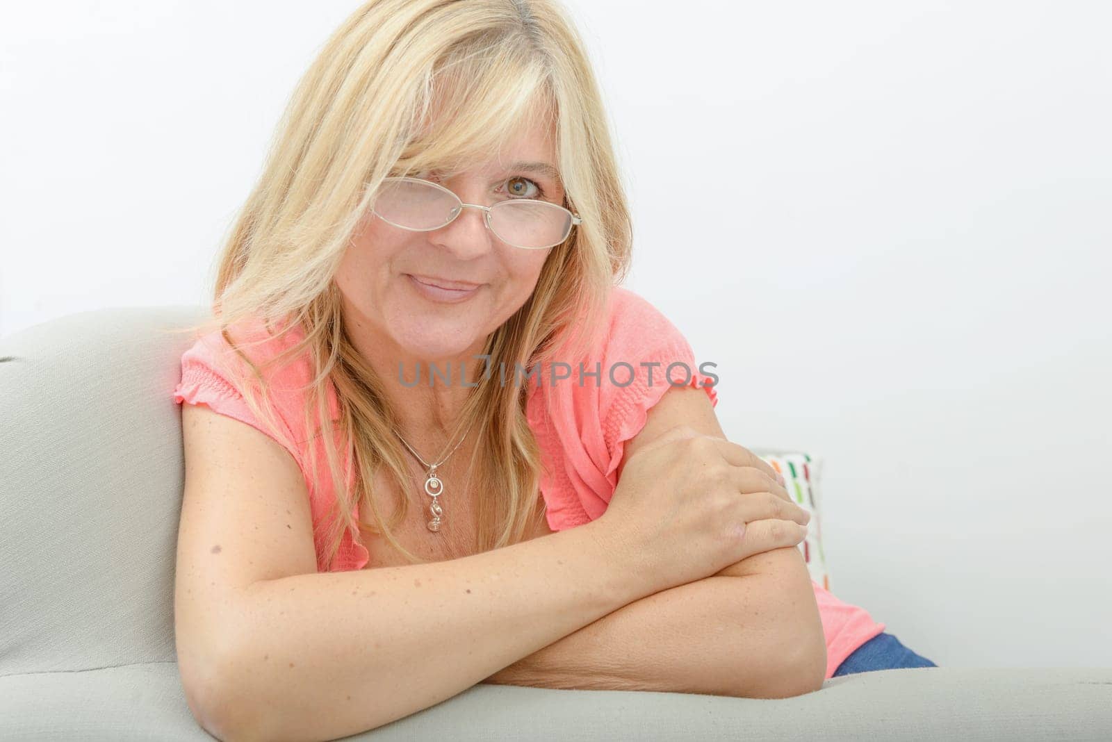 Portrait of mature woman relaxing in sofa