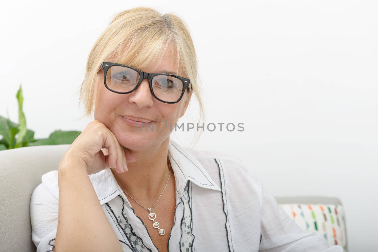Portrait of mature woman relaxing in sofa
