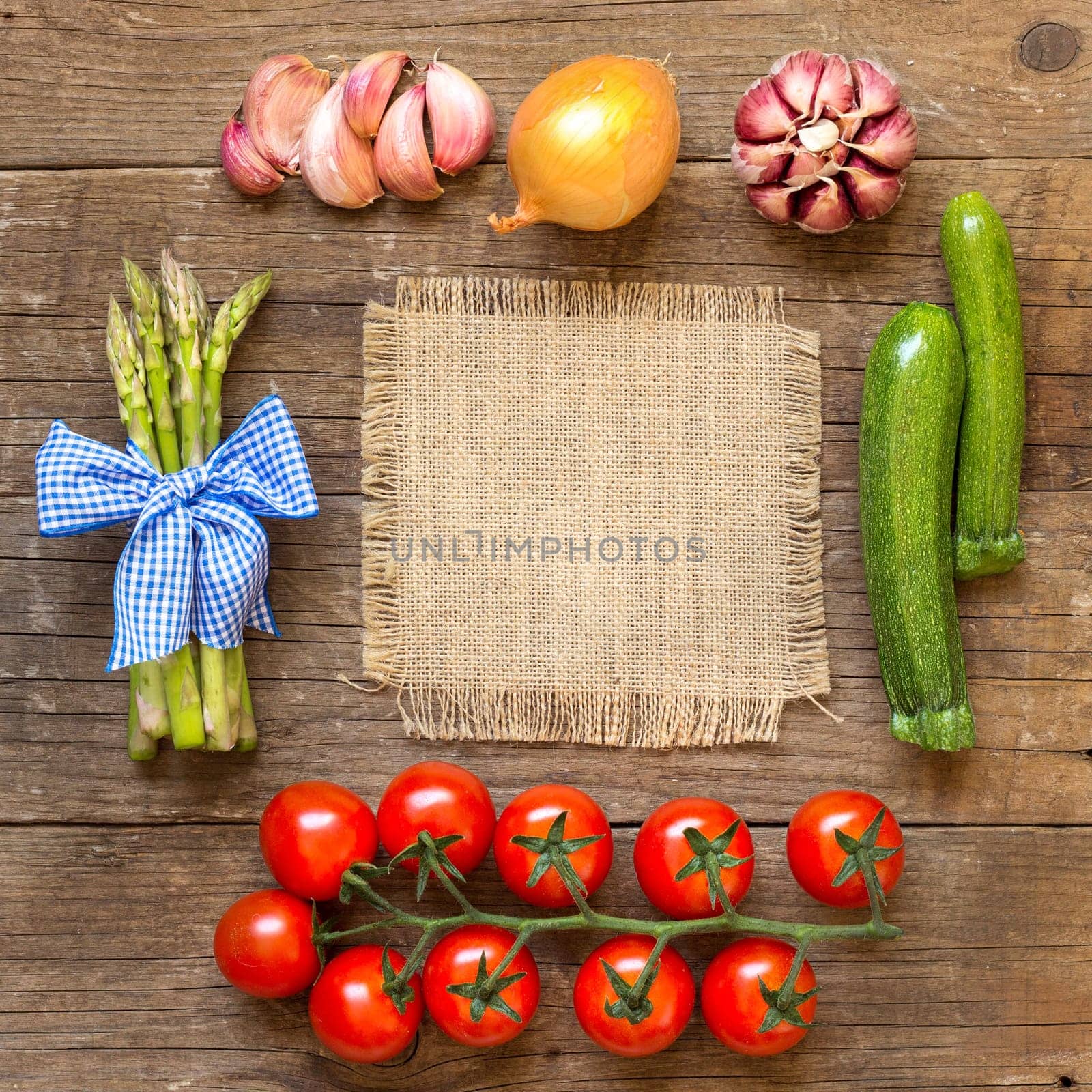 Organic vegetables on a wooden table with burlap