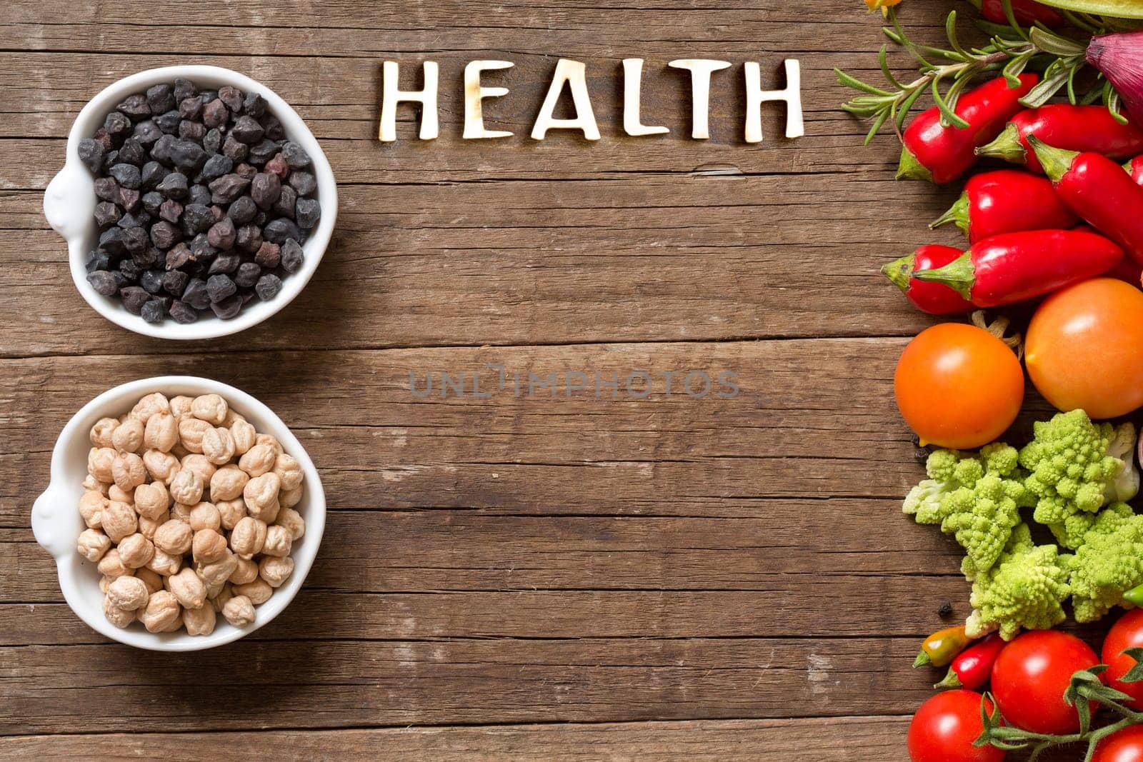 Vegetables and chickpea on a wooden table background