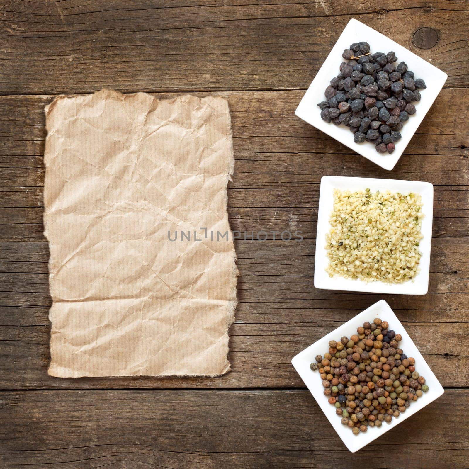 Roveja, hemp seeds and black chickpea on a wooden table
