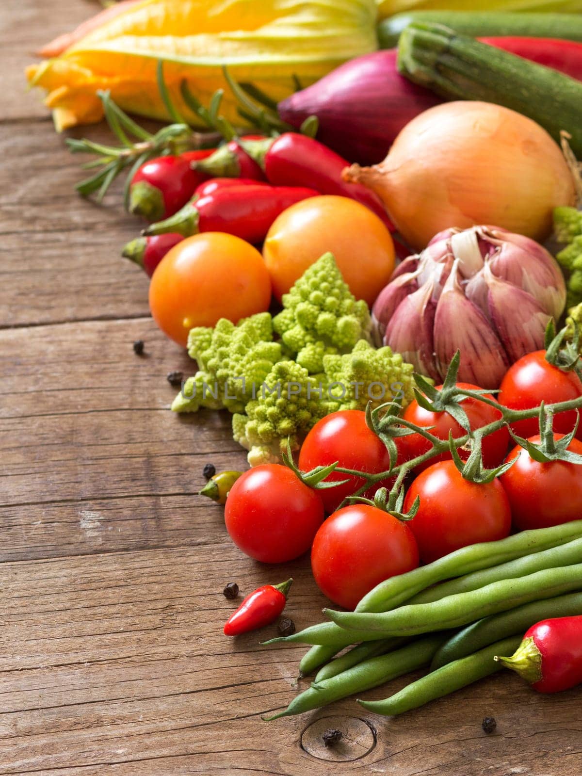 Colorful vegetables on burlap and wooden table