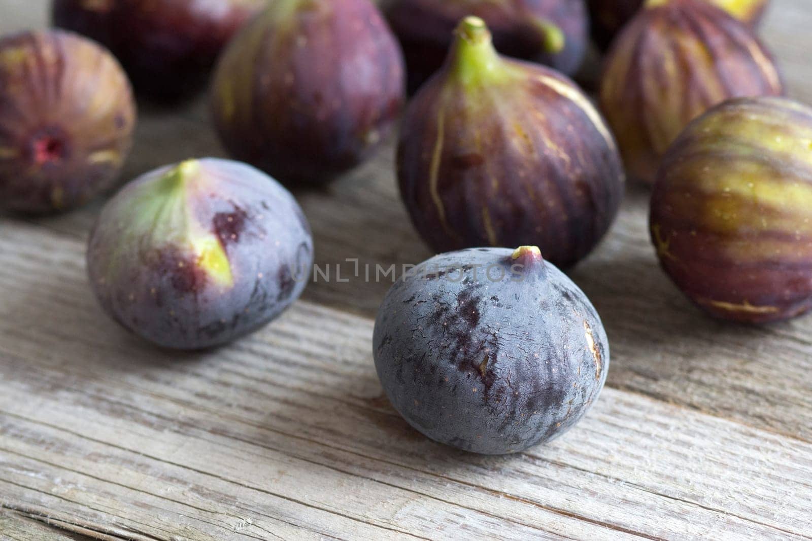 Fresh fruits - figs on the wooden table