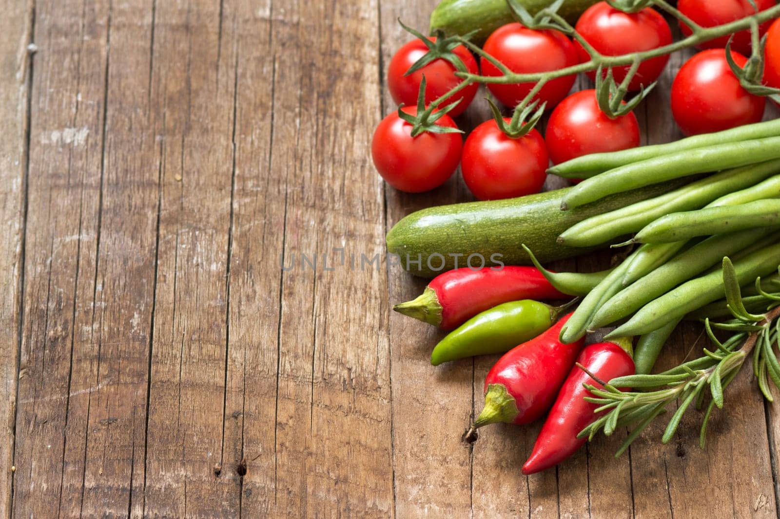 Red and green vegetables on a wooden table