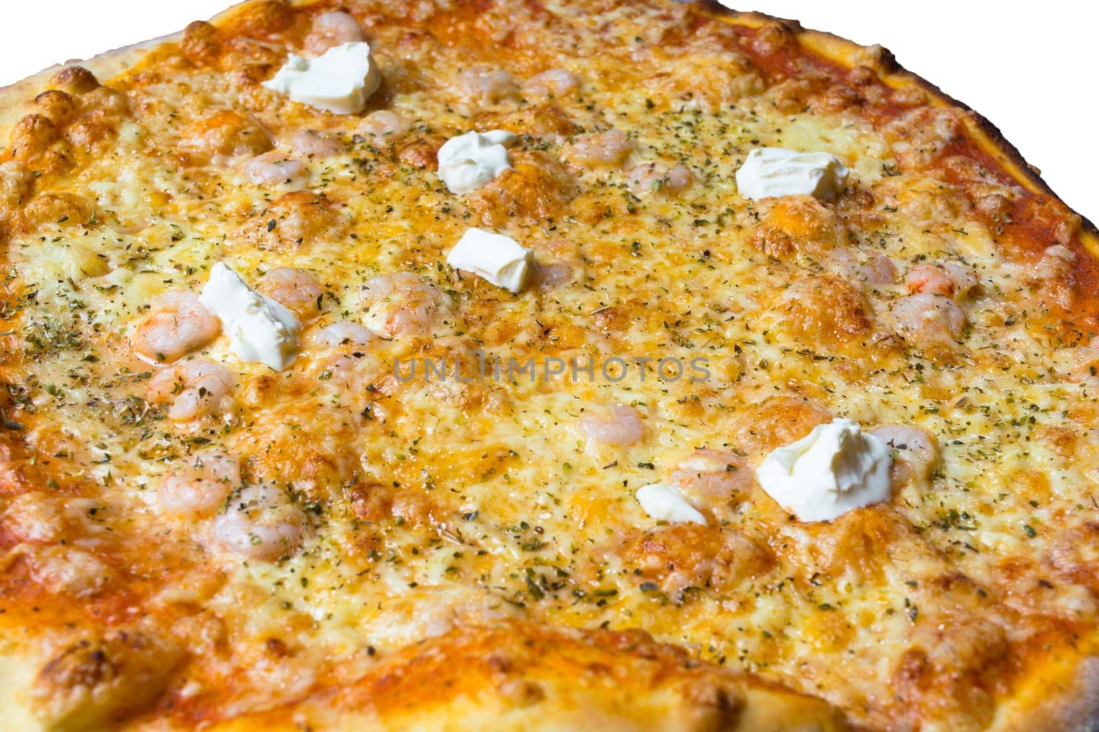 Pizza with pranels crème fraiche,cheese,tomatoes and pesto sauce..