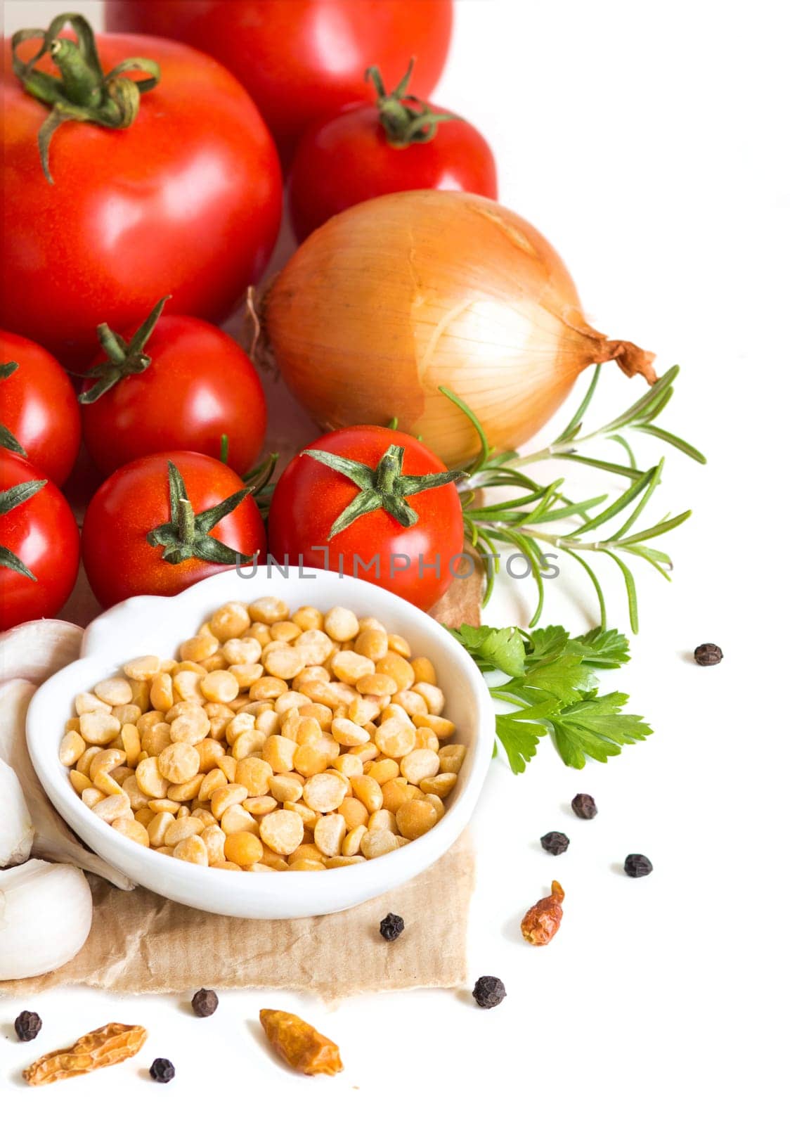 Vegetables and yellow peas on a white background