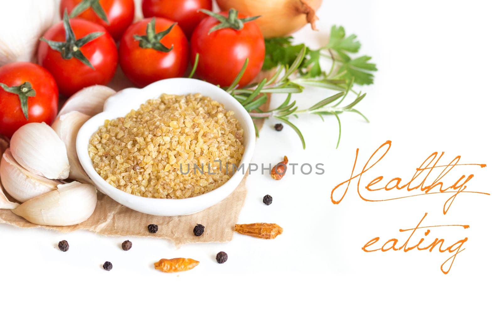 Bulgur in bowl and vegetables isolated on white