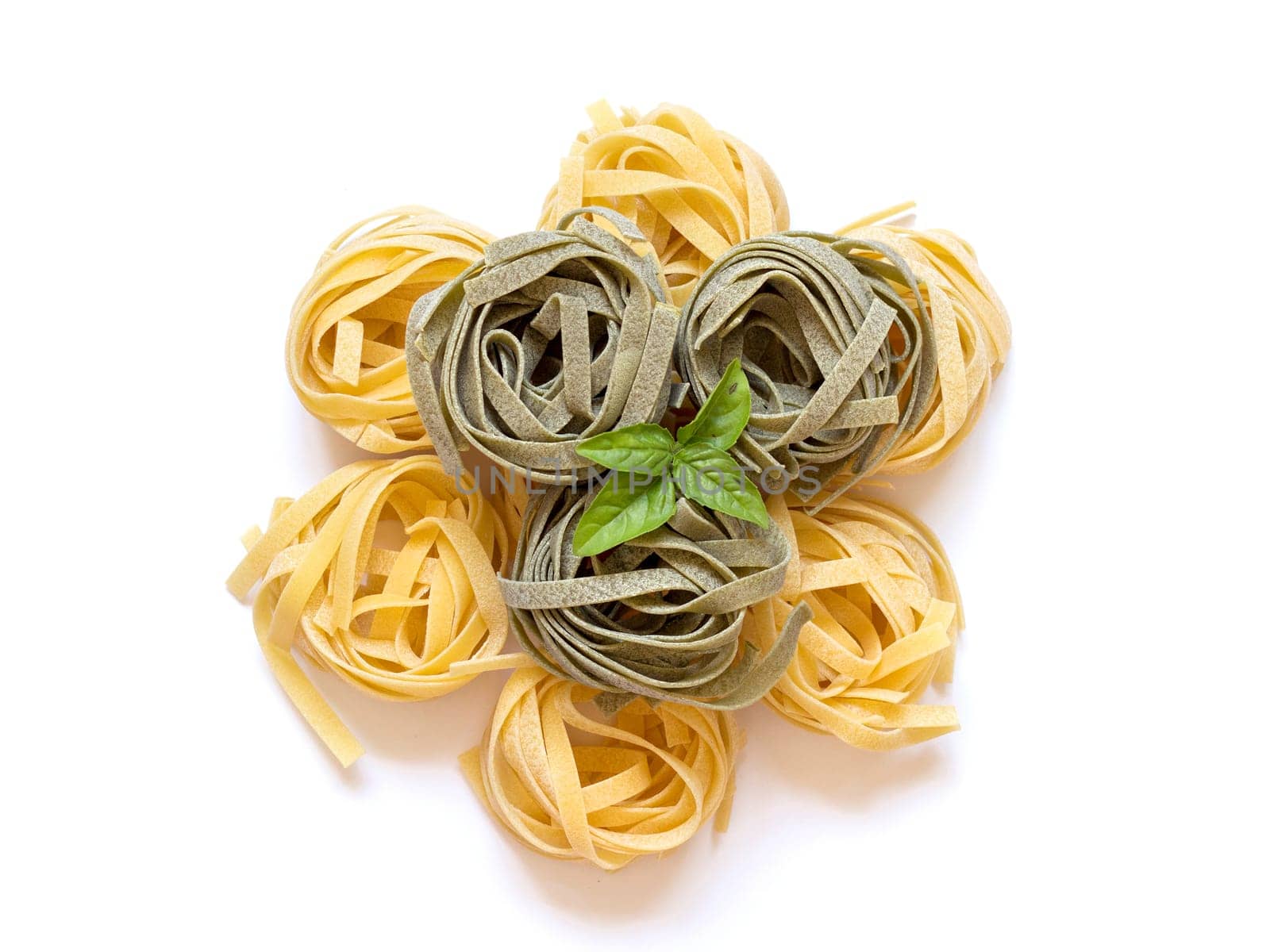 Color dry nest pasta on white background