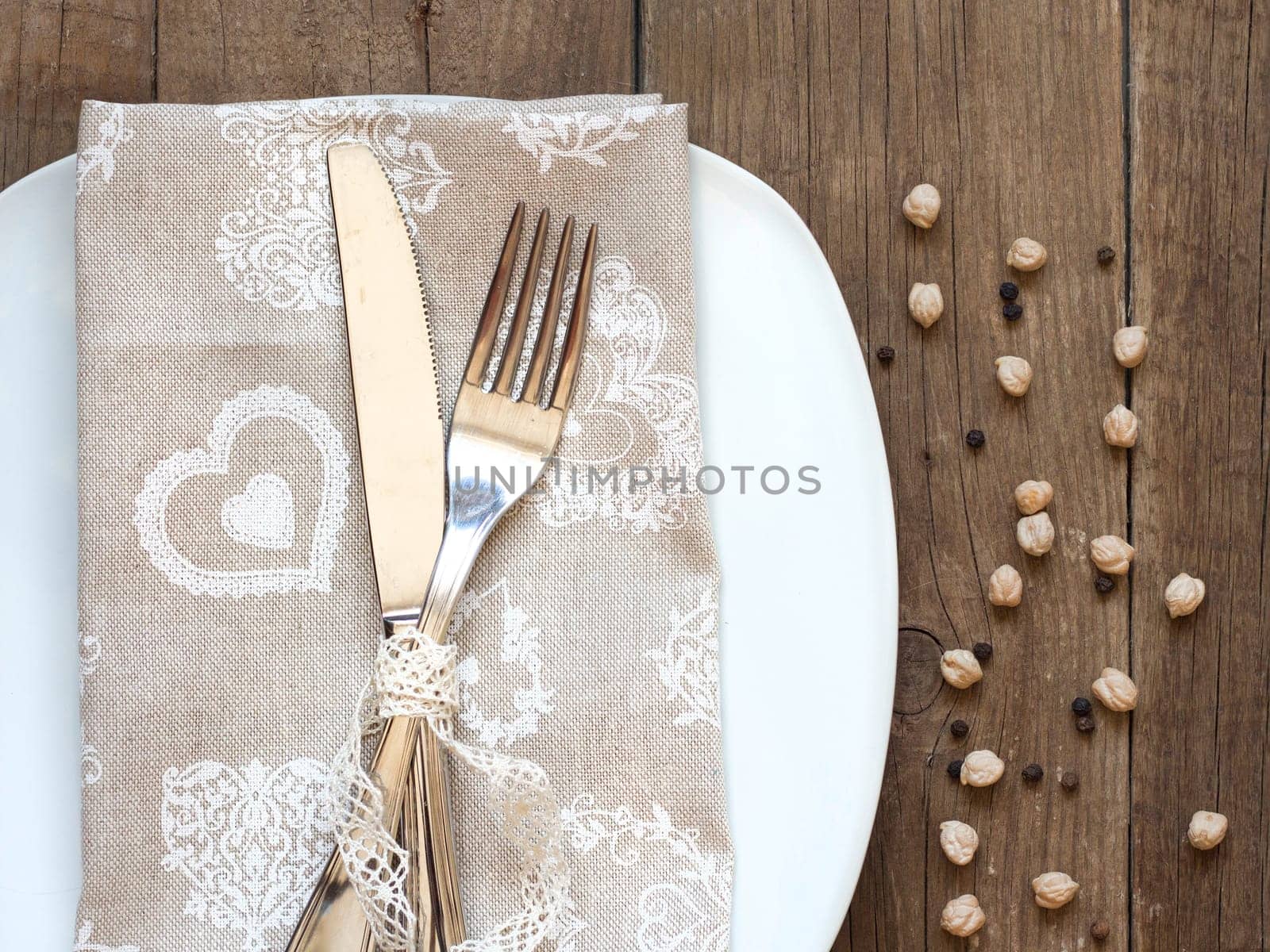 Rustic Table setting with vintage lace ribbon on old wooden table