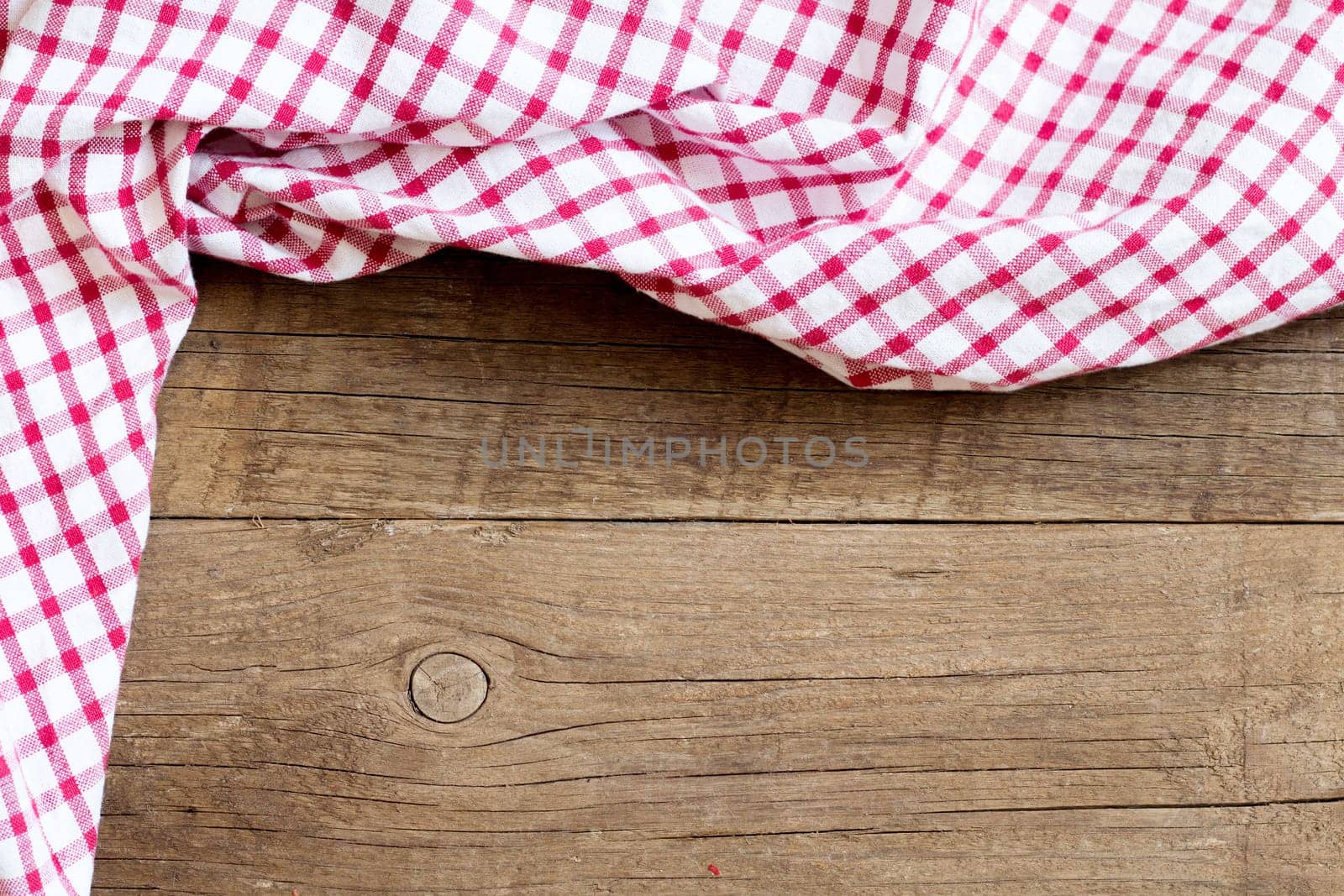 Checkered tablecloth on the old wooden table