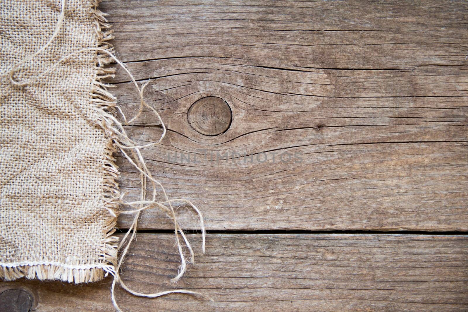Burlap and dark wood background