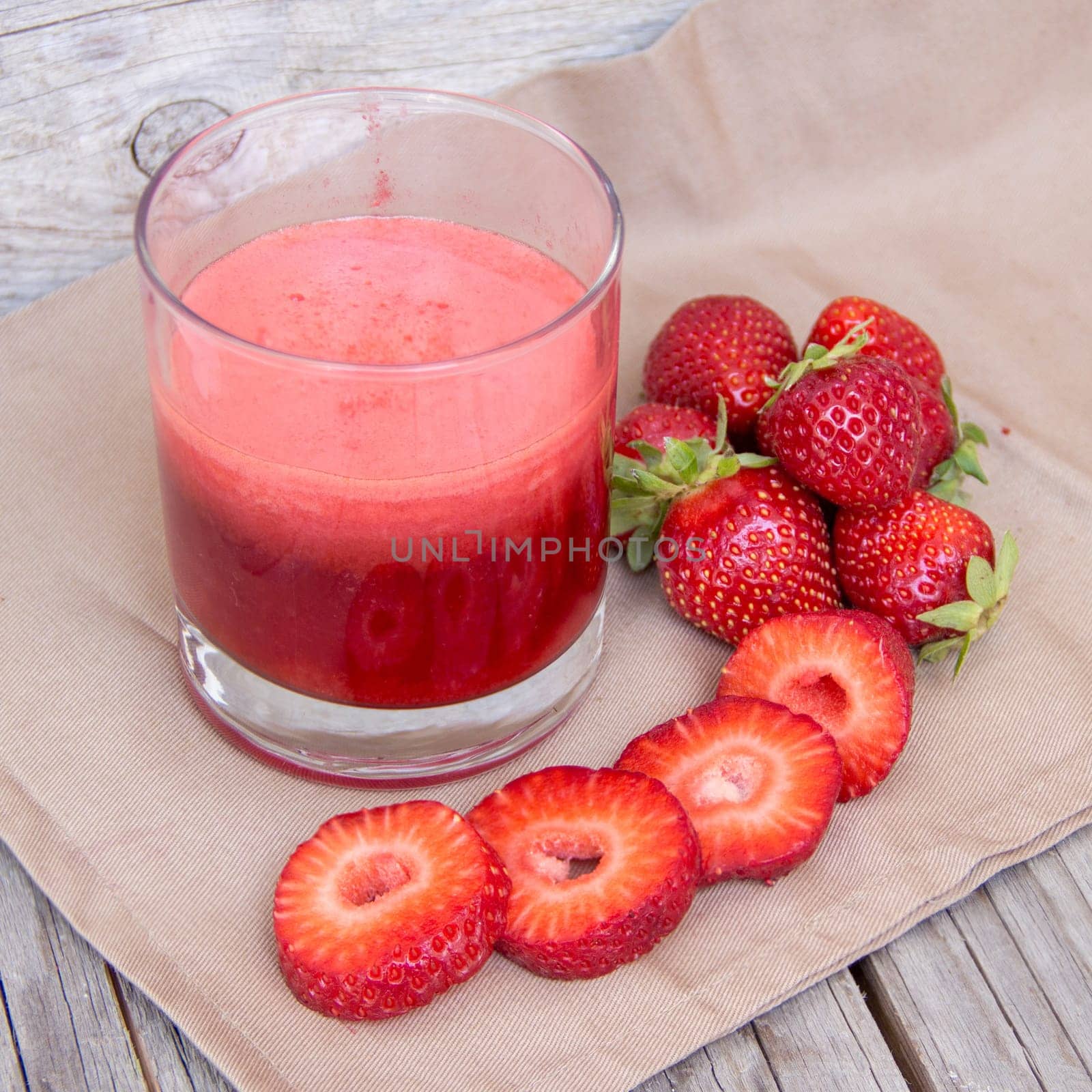 Fresh strawberry smoothie juice and strawberries