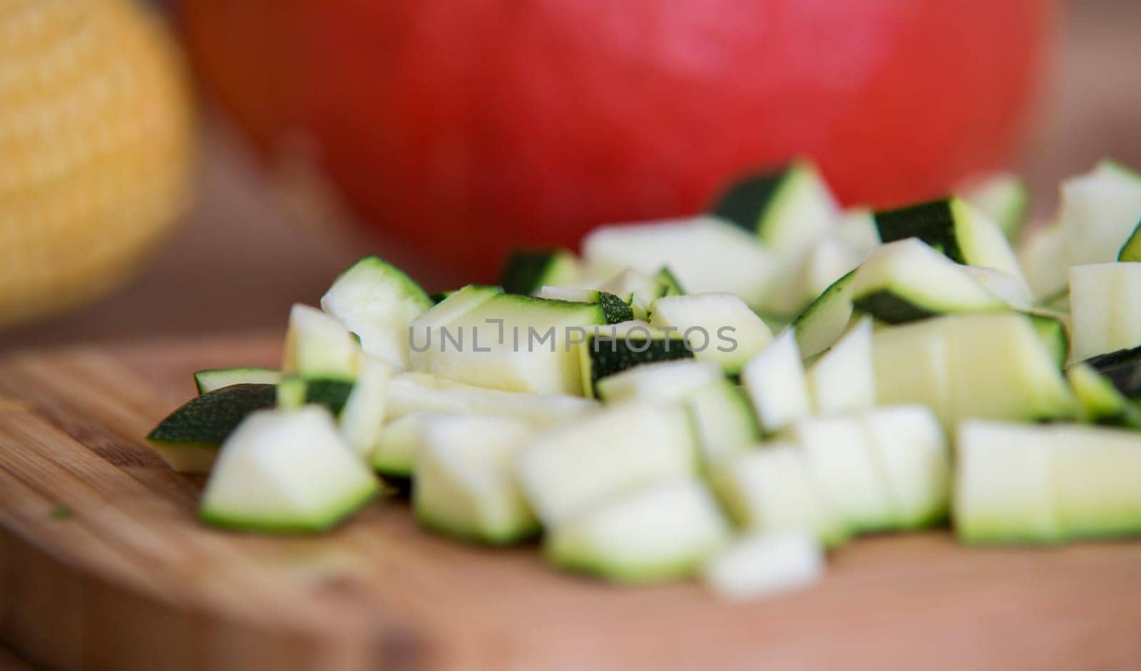 close up on zucchini pieces on wood