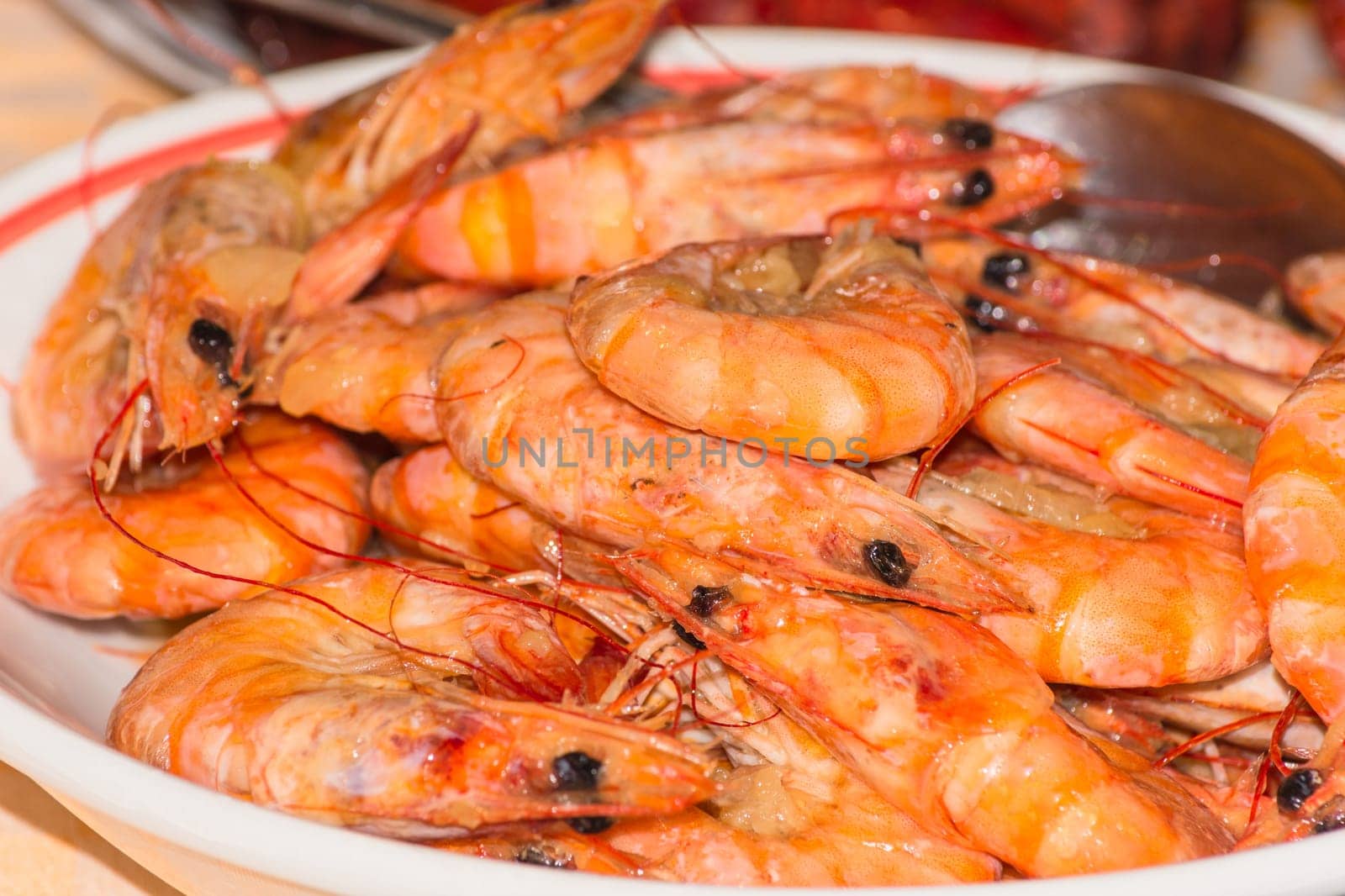 Close-up,delicious grilled prams with sauce on a plate. .