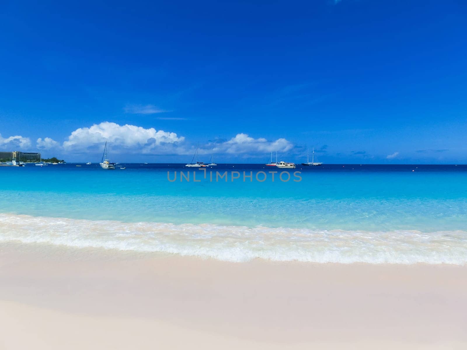 The tropical beach, Barbados, Caribbean with blue water