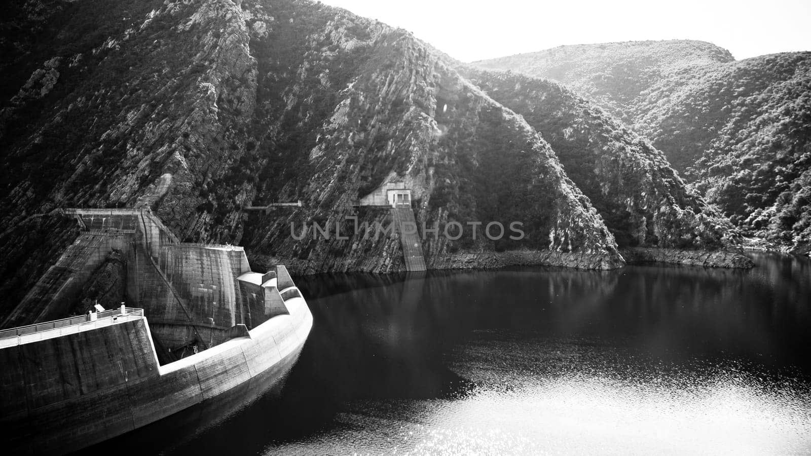 The Kouga Dam is an arch dam on the Kouga River about 21 km west of Patensie in Kouga Local Municipality, South Africa.
