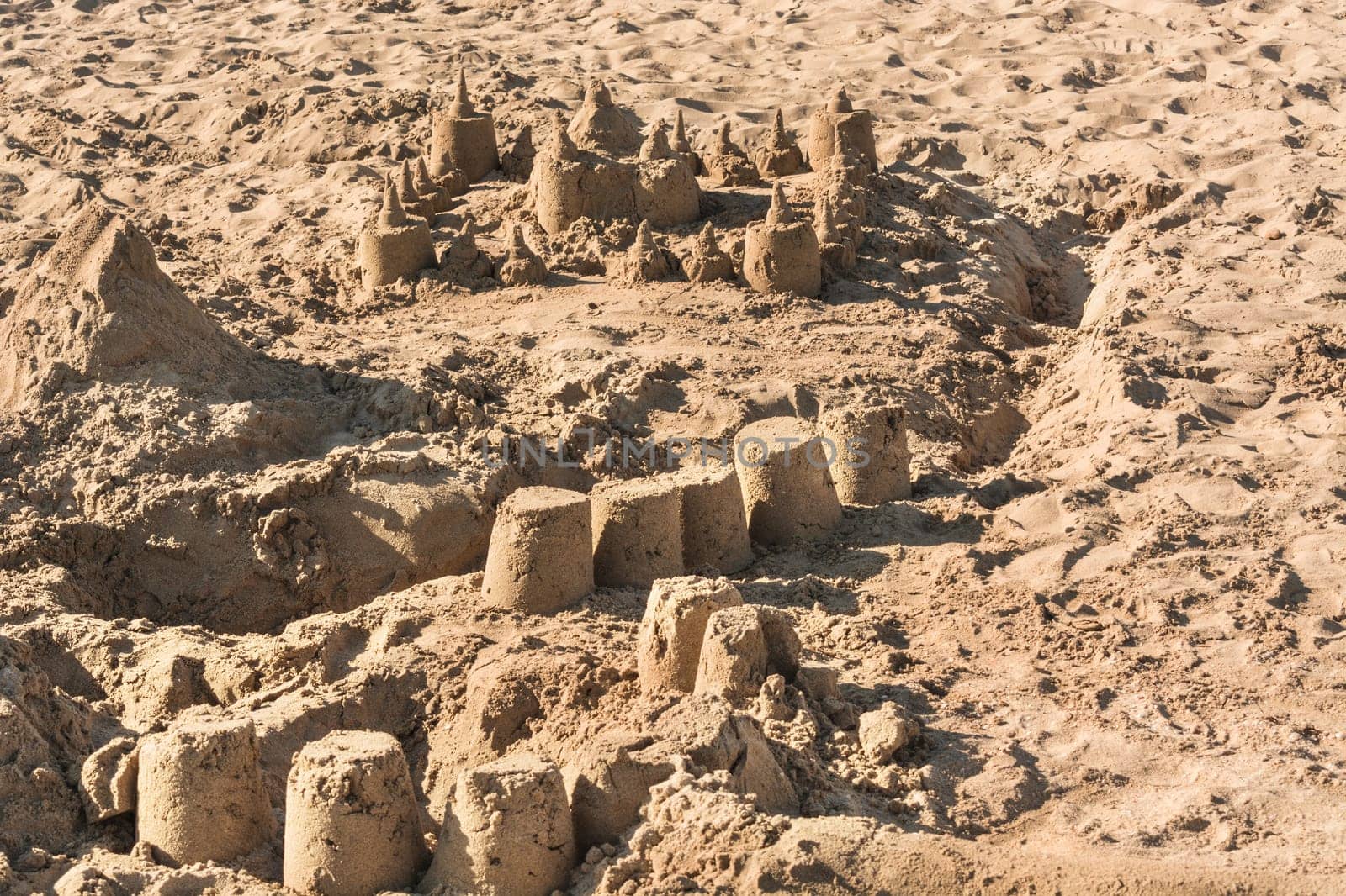 Close-up of a sand castle on a sandy beach..