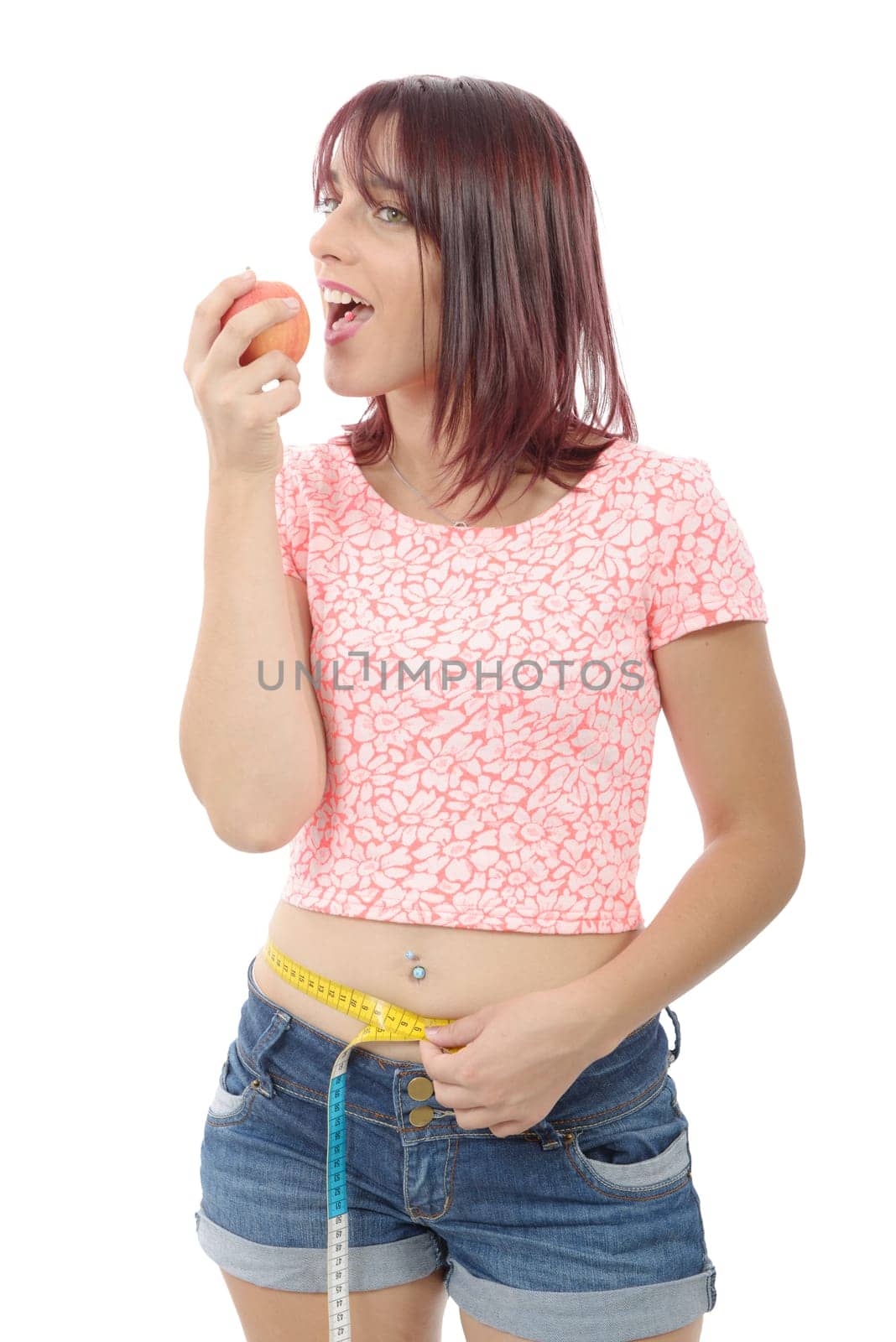 Young woman eating apple, isolated on white background