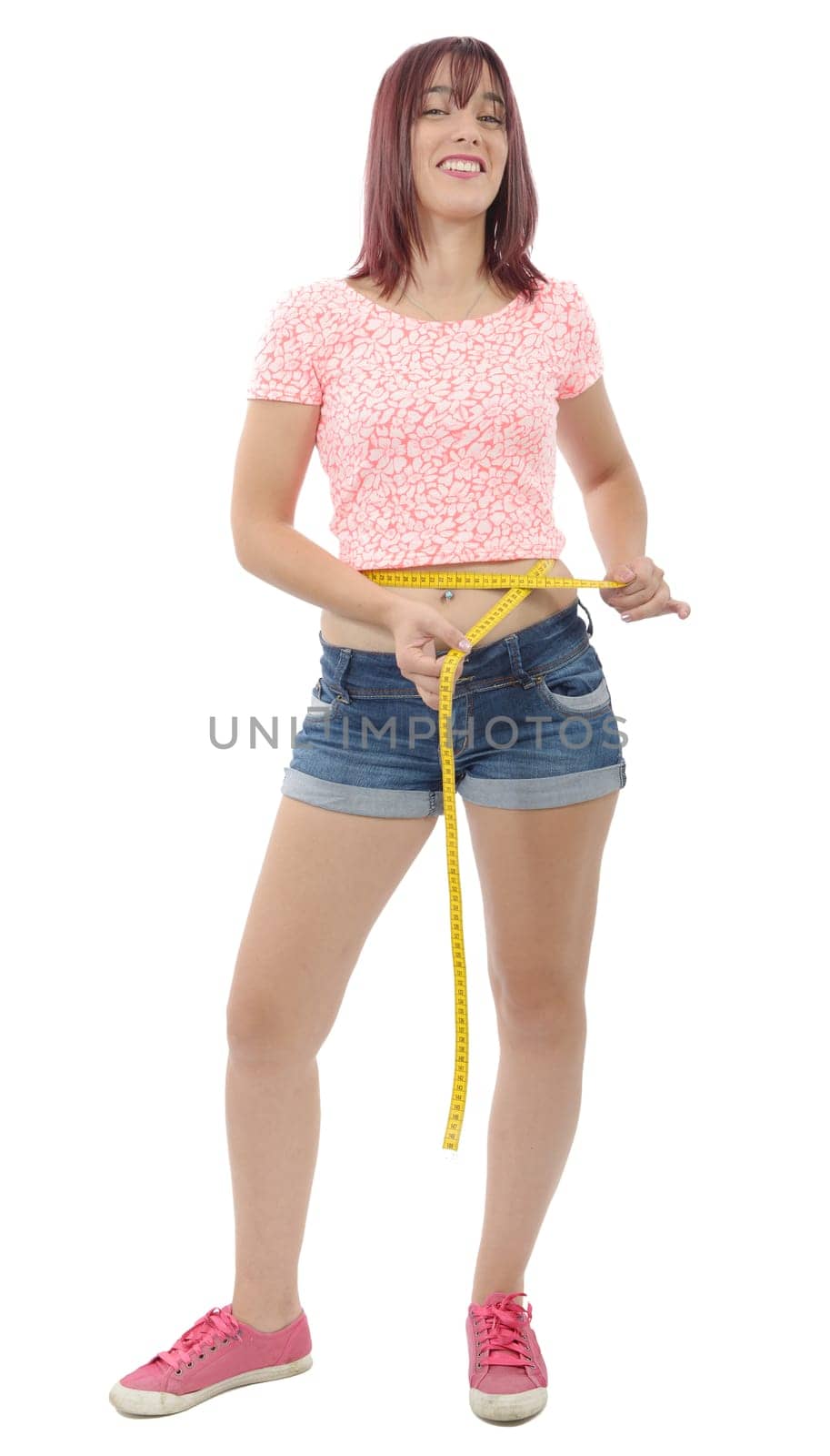 young woman measuring her waist on white background
