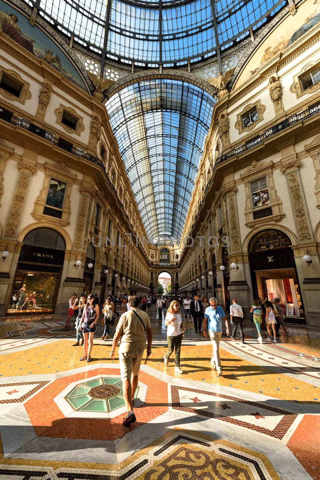 MILAN, ITALY - AUGUST 29, 2015: Luxury Store in Galleria Vittorio Emanuele II shopping mall in Milan, with tasted Italian restaurants