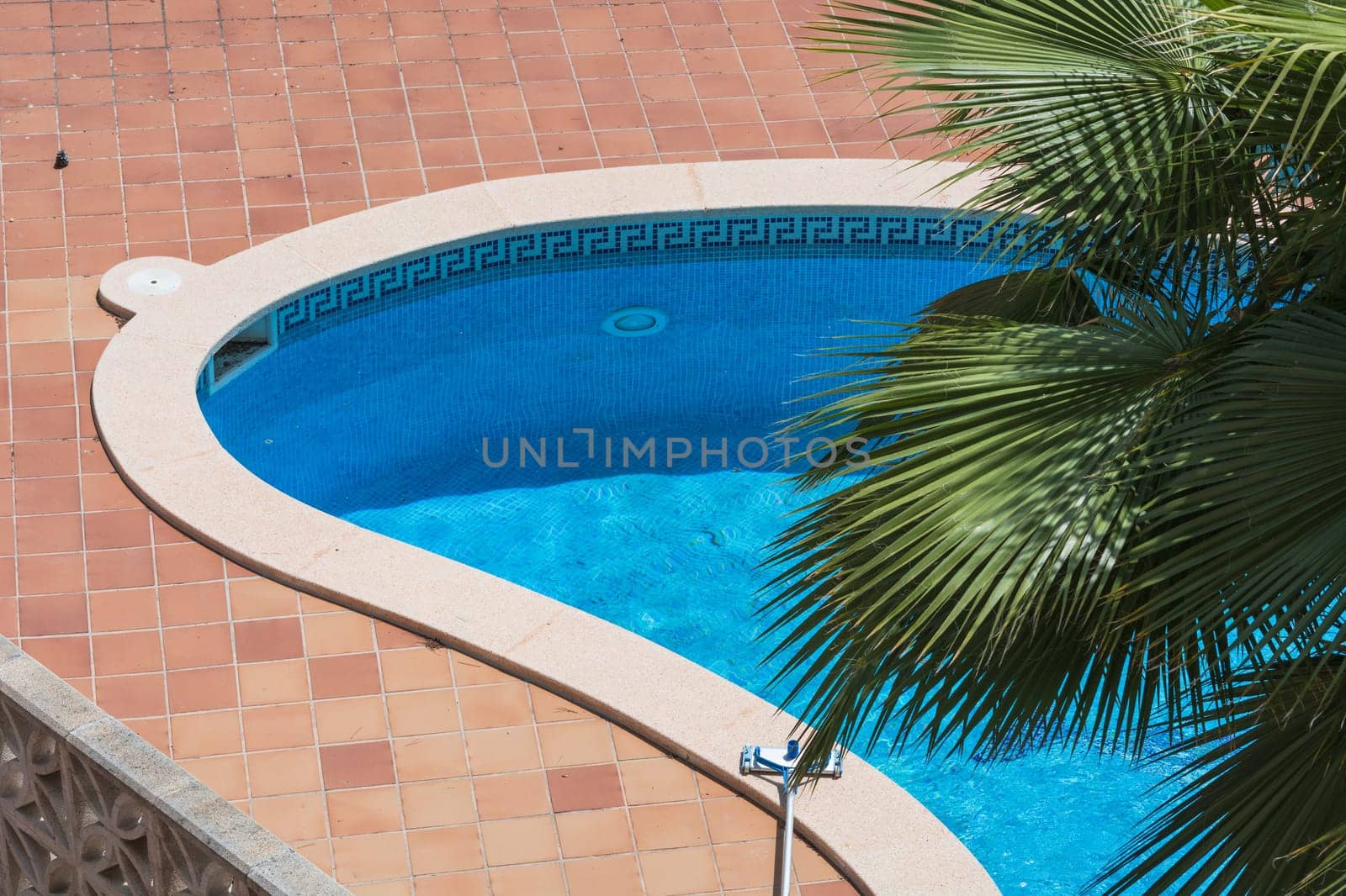 Outdoor swimming pool,whirlpool with blue tiles.