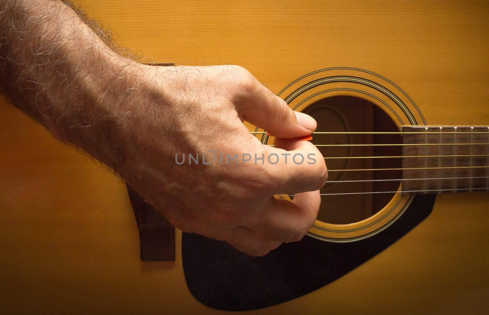 Practicing in playing guitar. The old men playing guitar