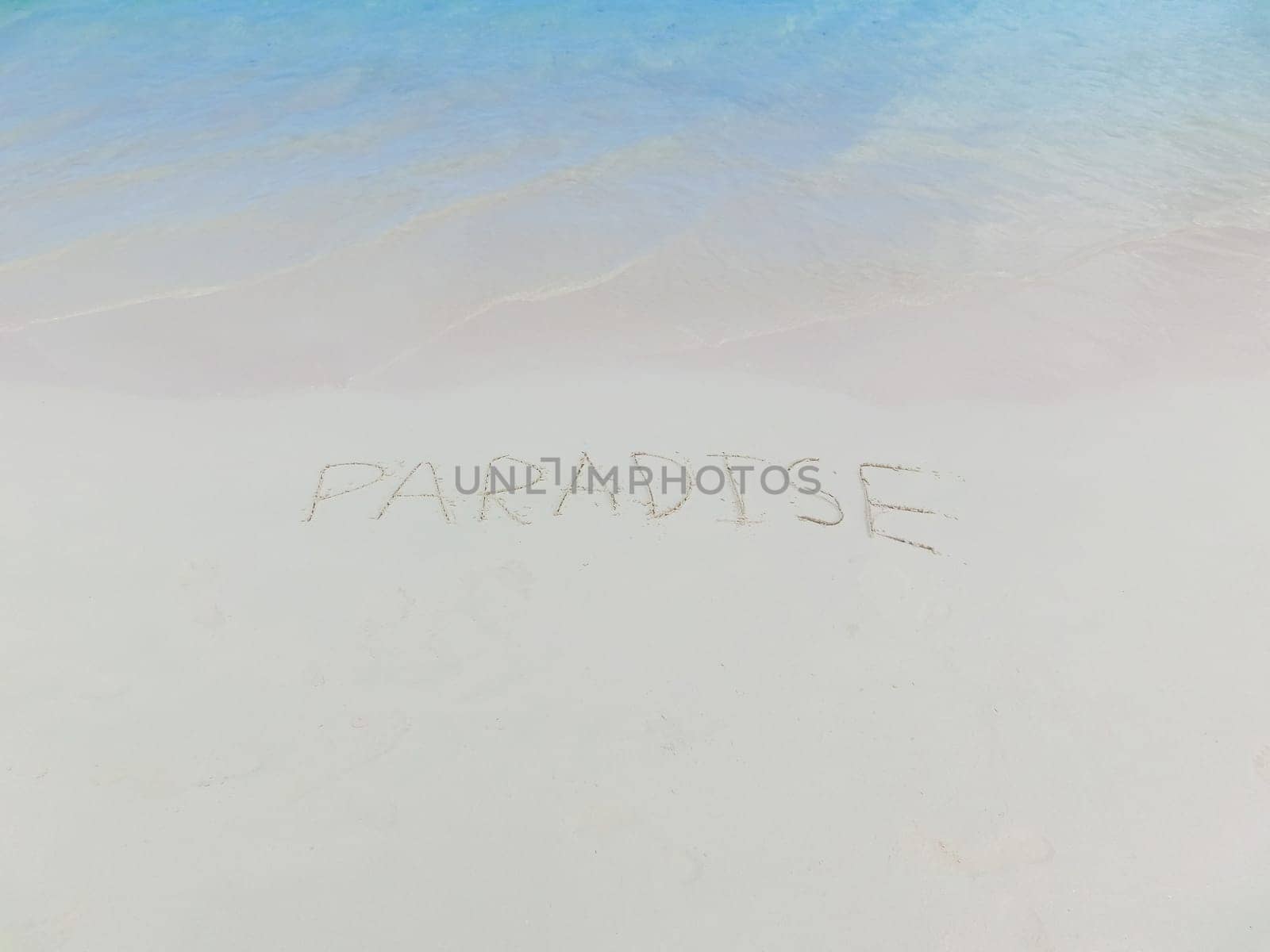 The inscription on and from the sand Paradise