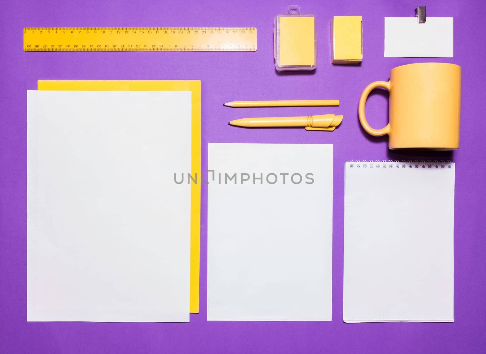 Mock-up business template with cards, papers, pen on lilac background.