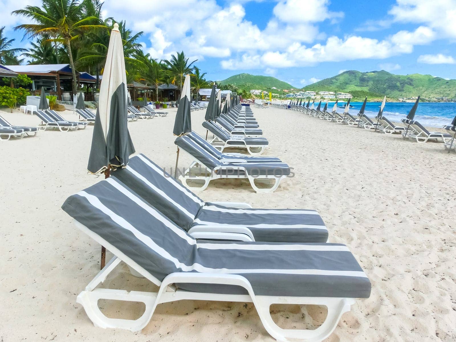 The chairs and umbrellas on Caribbean tropical beach