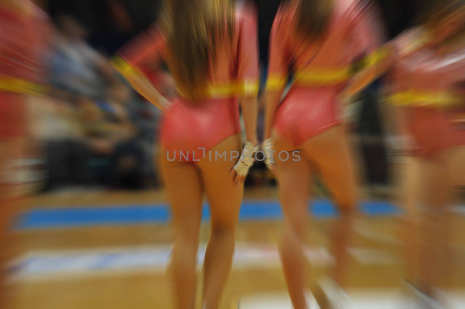 closeup of a young group of girls. cheerleaders performance at competitions,motion blur effect