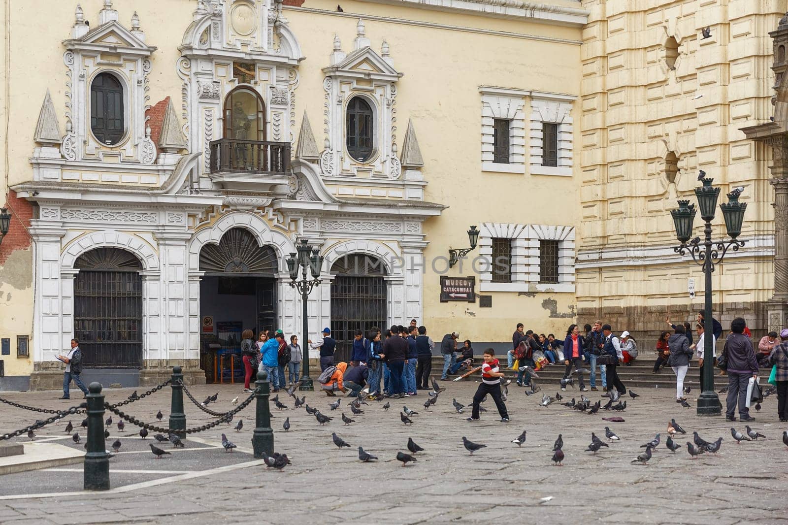 People Waiting to Visit Monastery of San Francisco in Lima, Peru. The church contains a museum and catacombs which are popular place to visit by tourists.