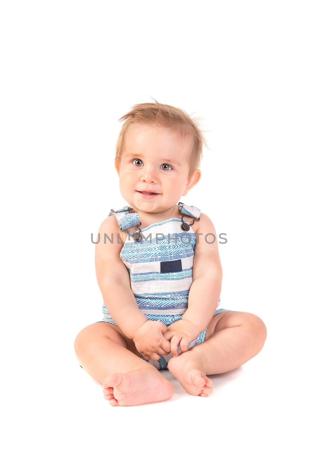 Beautiful baby posing isolated in white background