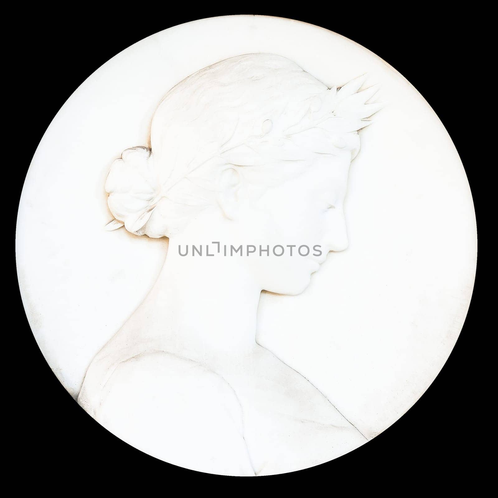 Antique cameo with ladies face. Black background
