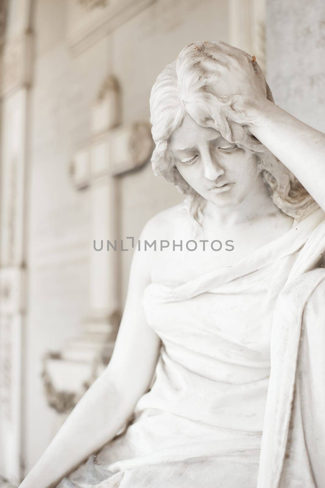 More than 100 years old statue. Cemetery located in North Italy.