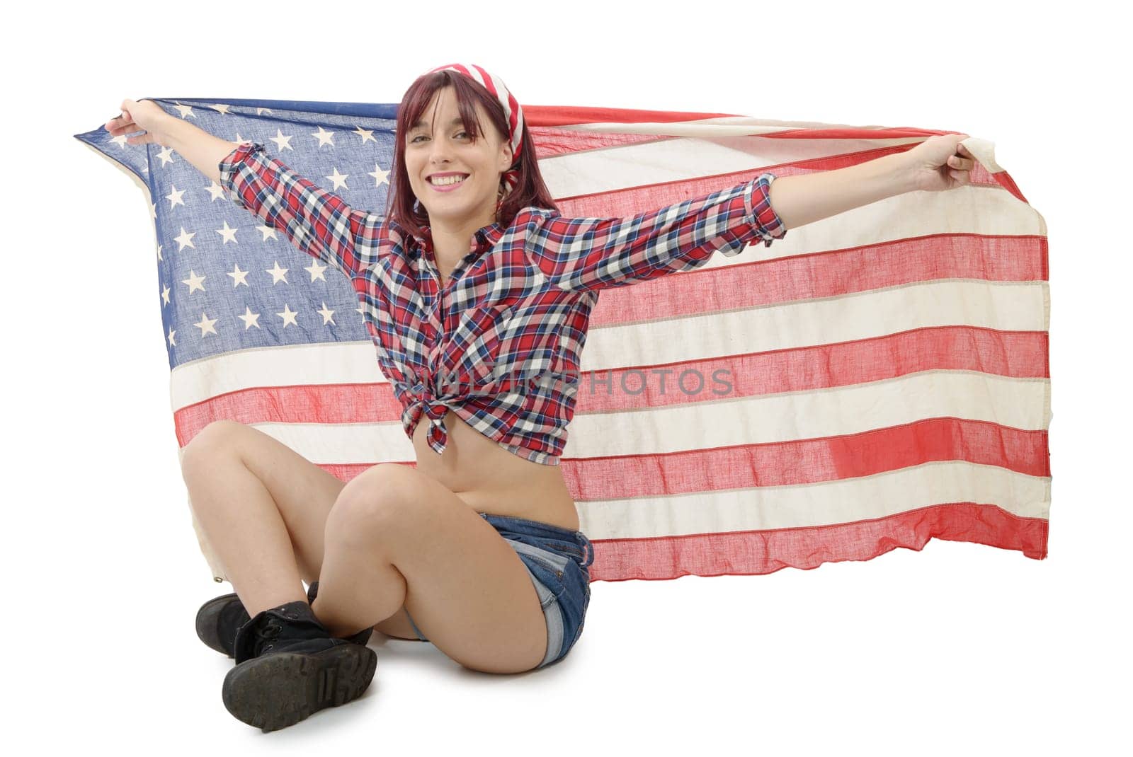 a pretty young woman holding an American Flag, on white background
