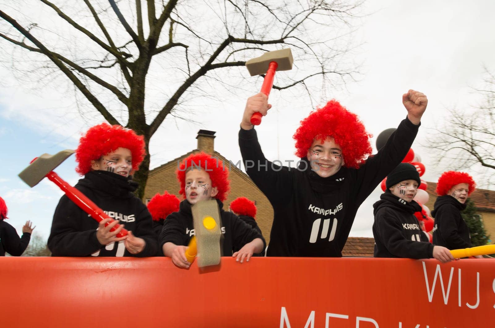 OLDENZAAL, NETHERLANDS - FEBRUARY 7, 2016: Unknown people joining the annual carnival parade with a decorated wagon