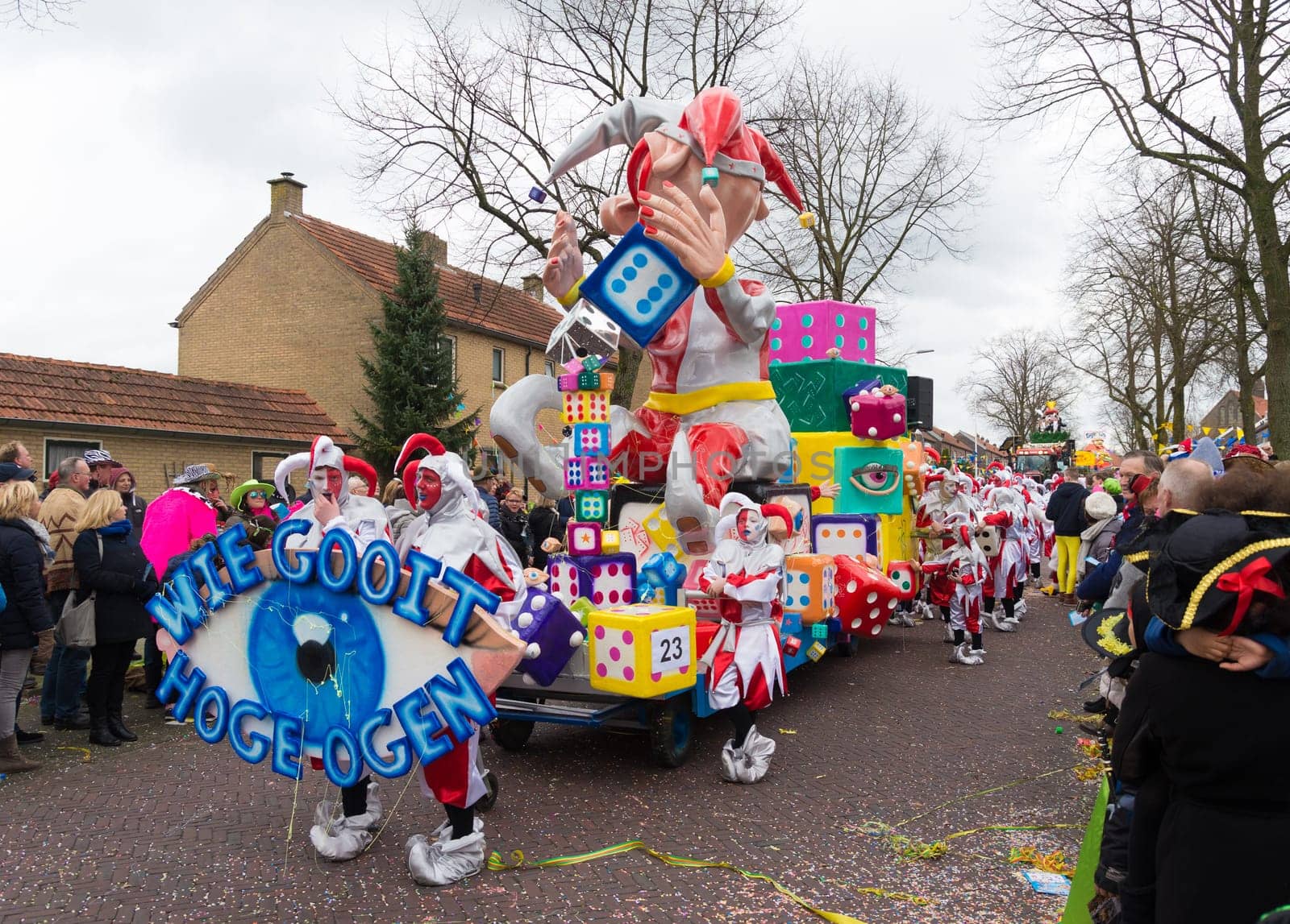 OLDENZAAL, NETHERLANDS - FEBRUARY 7, 2016: Unknown people joining the annual carnival parade with a decorated wagon