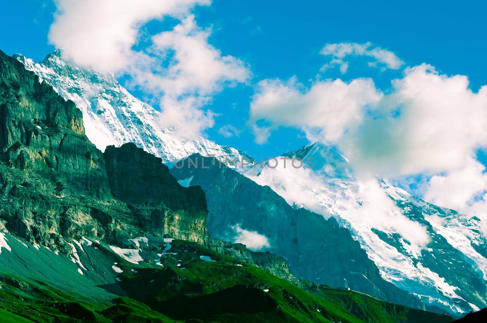 Swiss Alps - snow capped mountains and deep valleys, stunning view, breath-taking panorama