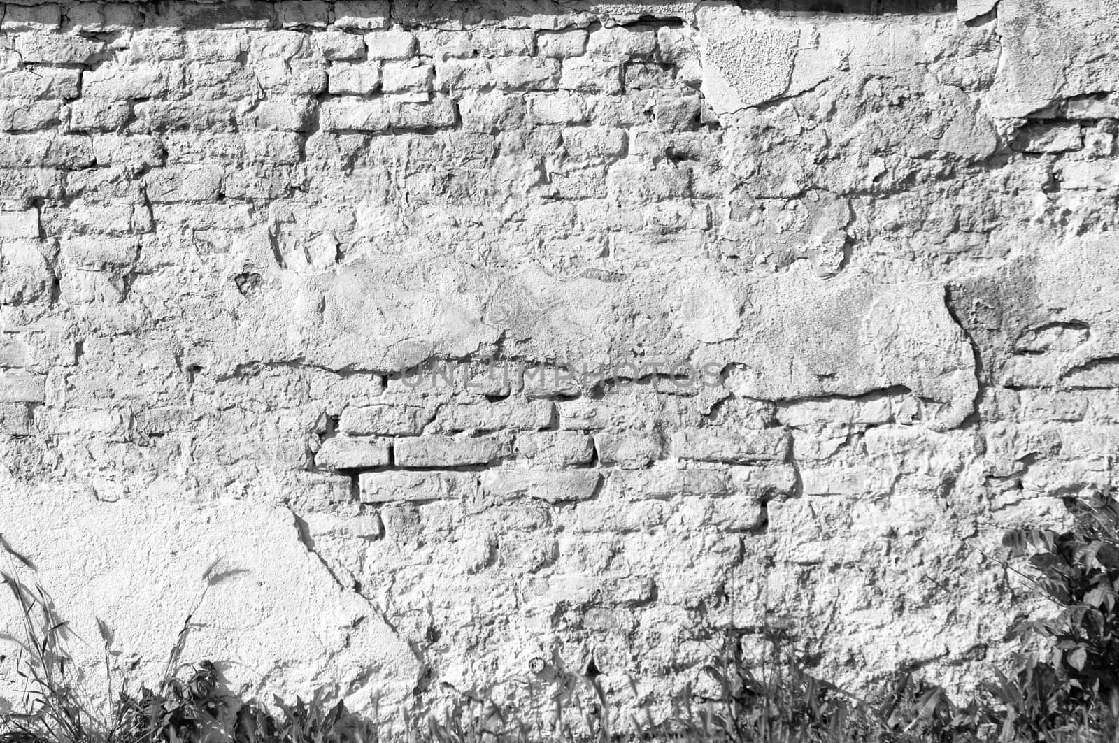Textured old brick wall background,monochrome