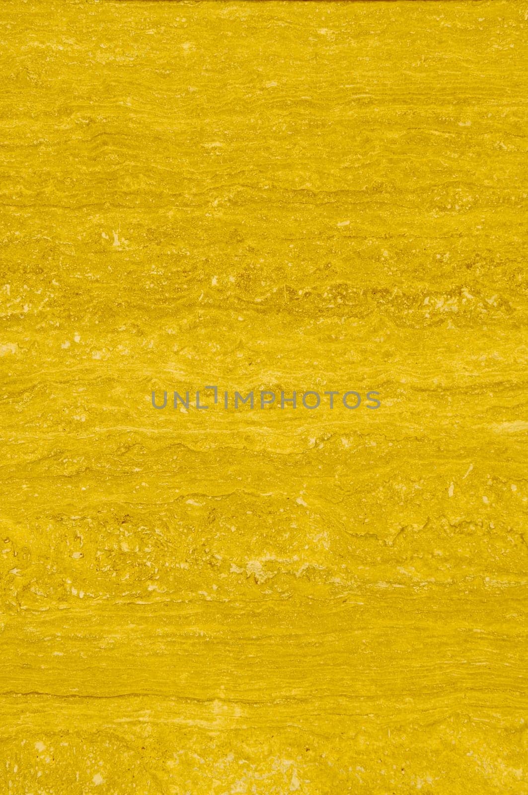 Textured marble background texture pattern with yellowish tones