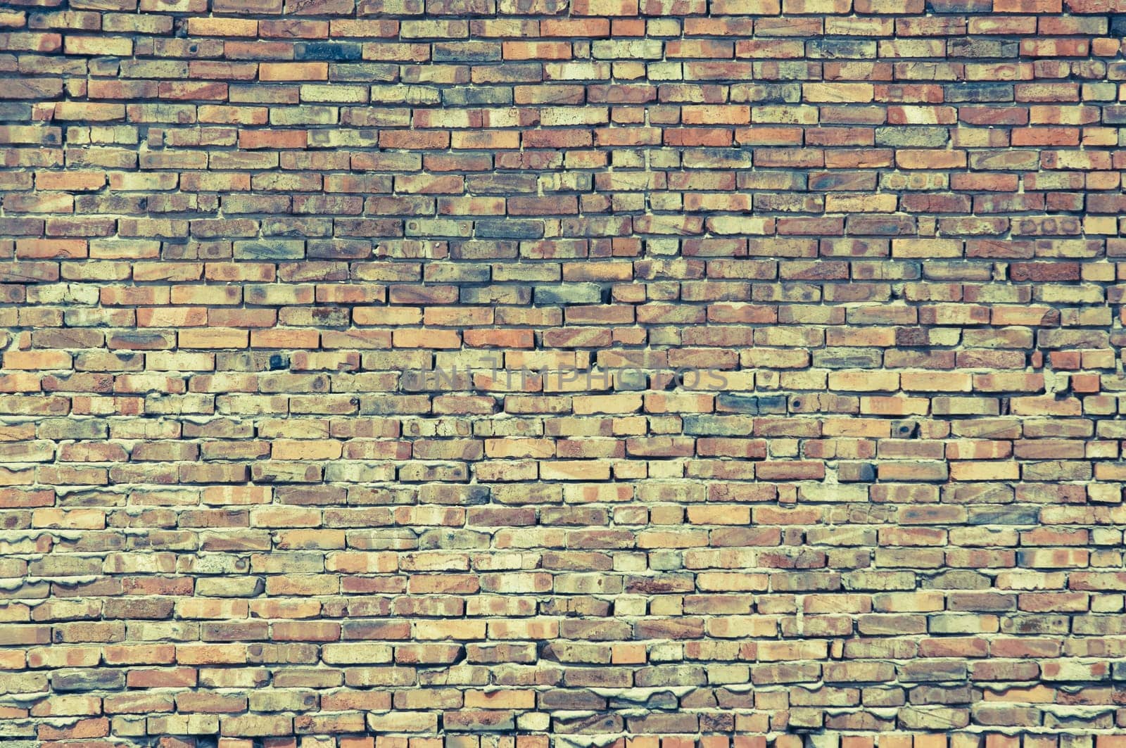 Textured old brick wall background, retro style with copy space