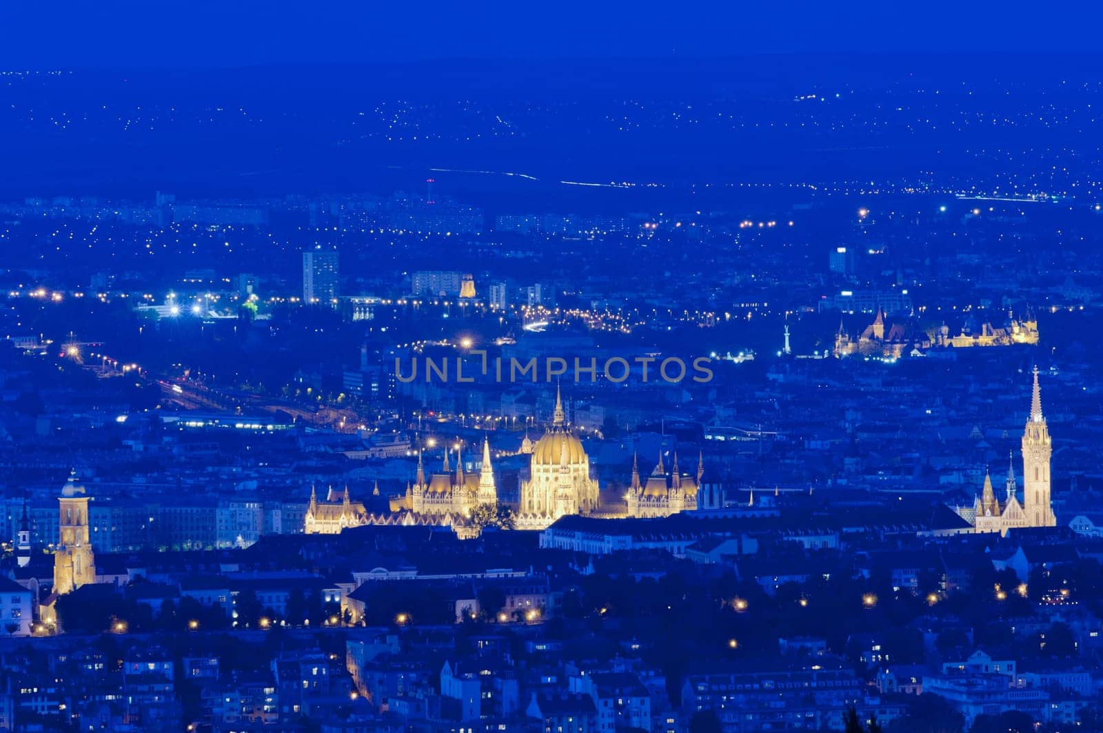 Evening skyline of Budapest with Parliament and Matthias Church, Hungary